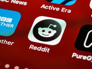 Reddit icon on a smartphone screen. Reddit is reportedly set to launch an IPO in March.