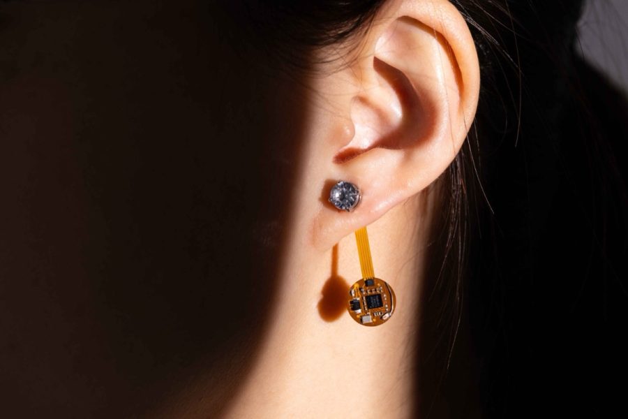 A person wearring the Thermal Earring